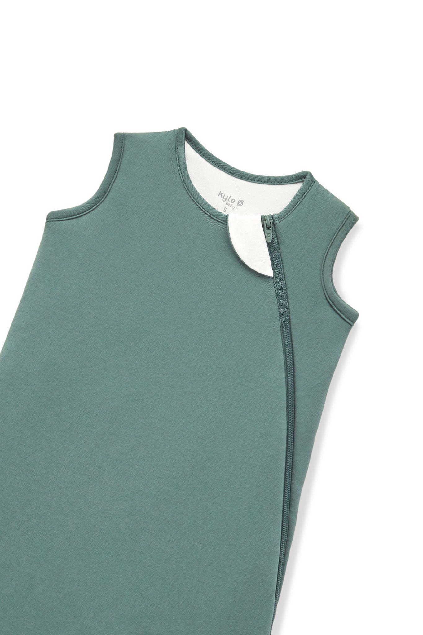 A close-up of a muted sage green color protective cover or sleeve with zipper, shown on a plain white background.