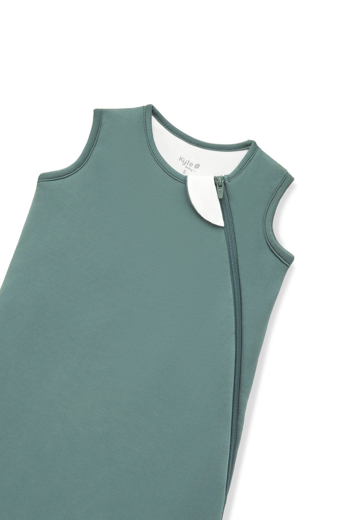 A close-up of a muted sage green color protective cover or sleeve with zipper, shown on a plain white background.