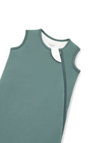 A close-up of a muted sage green color protective cover or sleeve with zipper, shown on a plain white background.