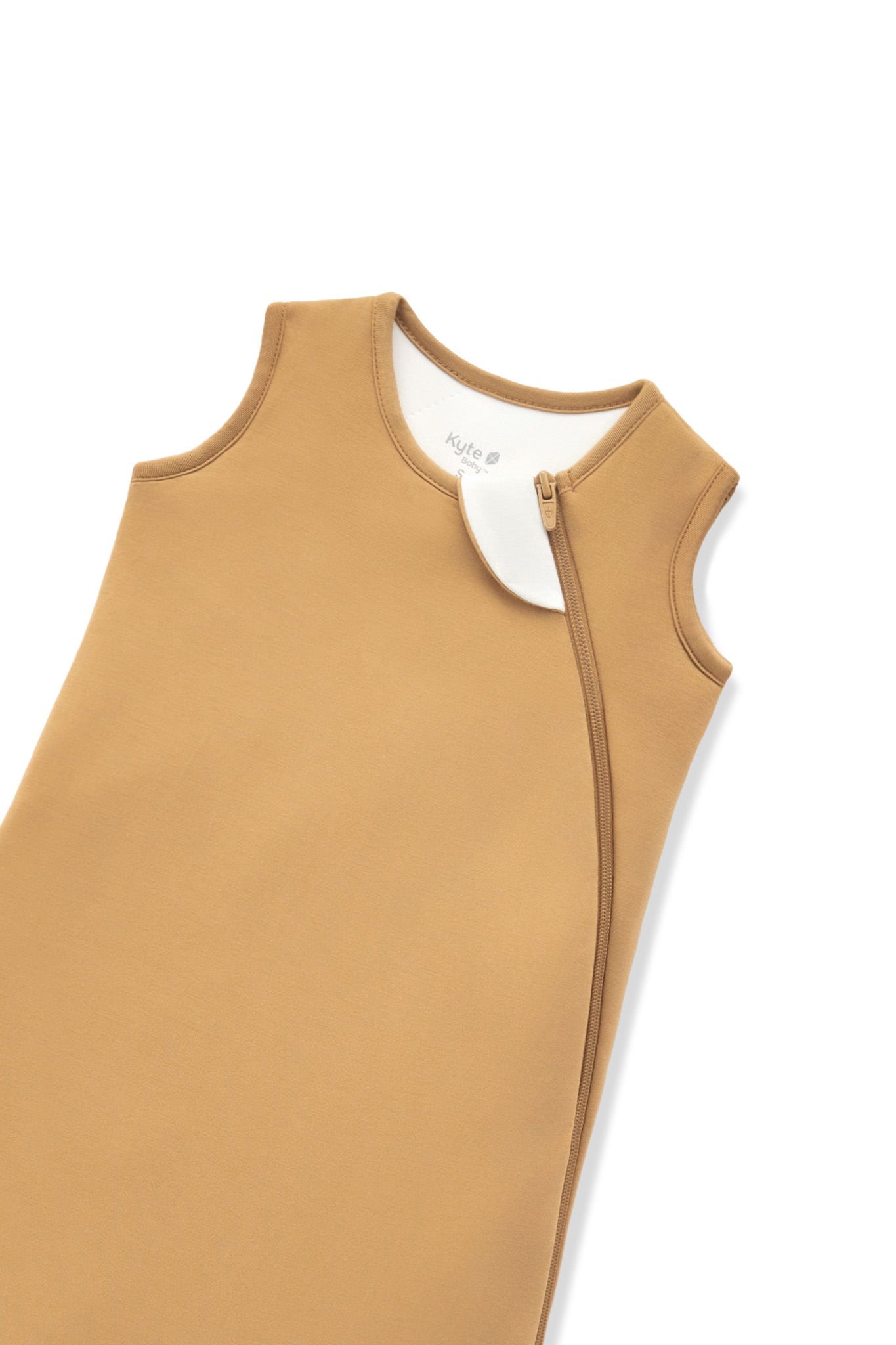 A close-up of a warm camel tan color protective cover or sleeve with zipper, shown on a plain white background.