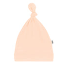 Beige baby hat on a white background
