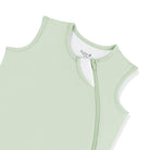 Light green sleeveless top with zipper on a white background