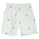 White shorts with red pattern on a white background
