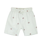 White shorts with red pattern on a white background