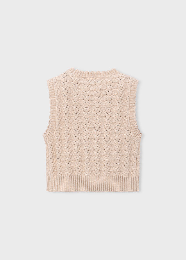 Beige knitted vest on a light gray background