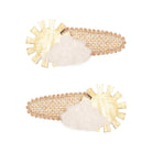 2 yellow hair clips on a white background
