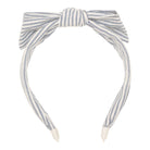 Striped headband with a bow on a white background
