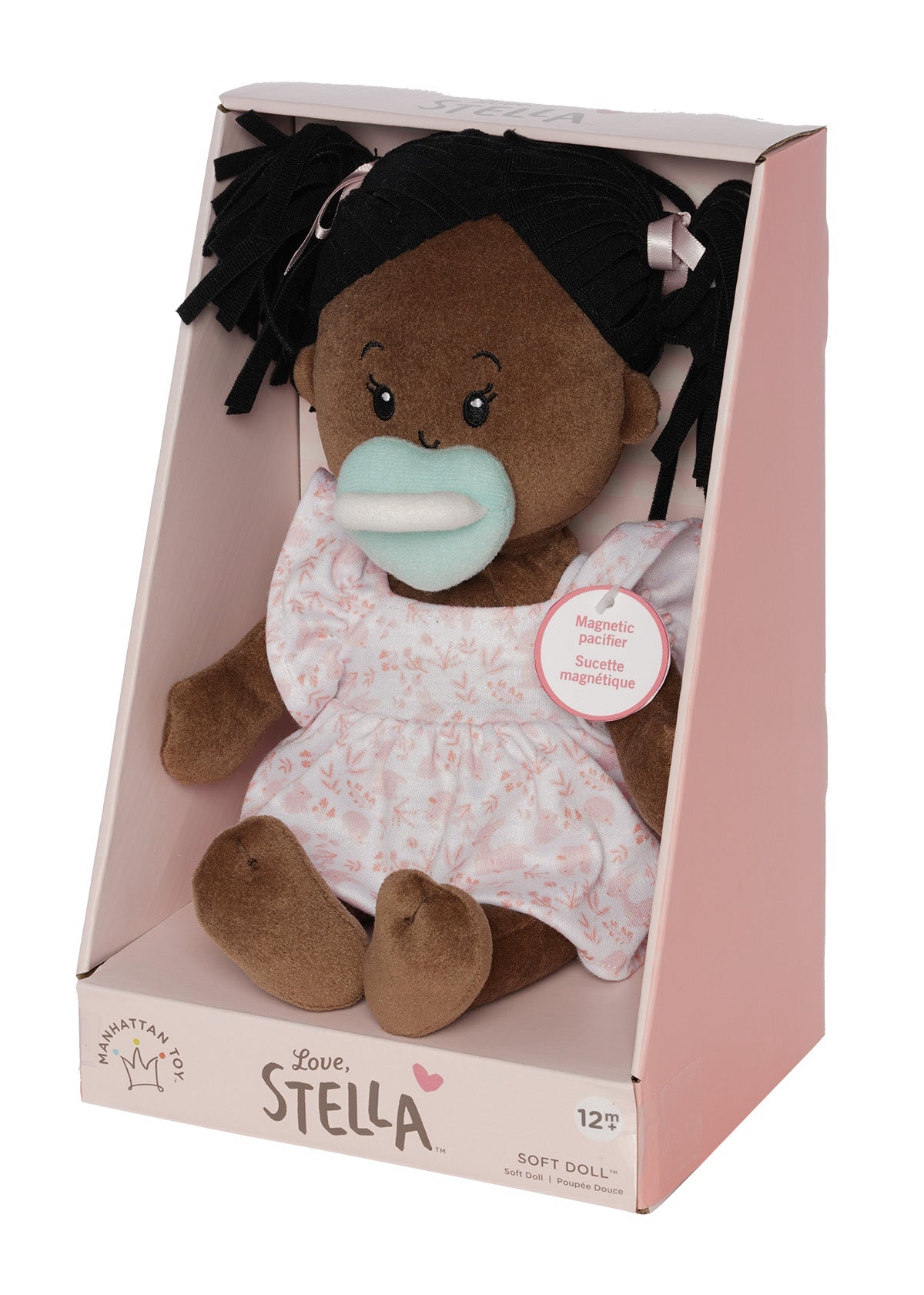 Plush doll with pacifier in a box, branded 'Love Stella'.