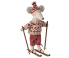 Knitted mouse figure in winter attire with a sweater, hat, and skis on a white background