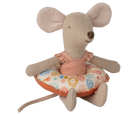 Stuffed mouse toy with a floral cushion on a white background