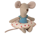 Plush mouse toy with a blue dress sitting on a polka dot cushion against a white background