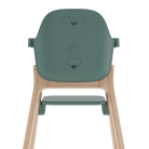 Rear view of a high chair with a muted sage green plastic seat and a light natural wood frame, shown on a solid white background.