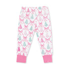White children's pajama pants with a pink and mint green Christmas tree and bow pattern, featuring solid pink ribbed ankle cuffs.