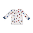 A white long-sleeve baby t-shirt with an all-over hockey player print, featuring navy blue ribbed cuffs.