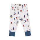 White children's pants with an all-over hockey player print and solid navy blue cuffed hems, shown flat on a white background.