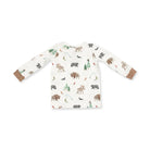 A long-sleeve baby shirt with an all-over woodland animal print on an off-white background, featuring brown cuffs.