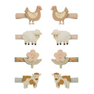 Set of six animal-themed hair clips on white background