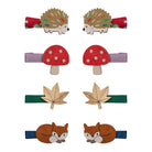 Set of animal-themed hair clips including hedgehogs, mushrooms, leaves, and foxes on a white background.