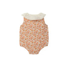Baby romper with floral pattern and ruffled neckline on a white background