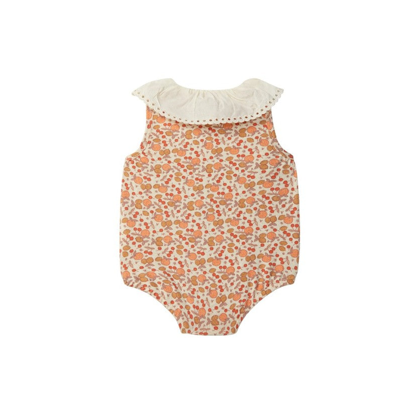 Baby romper with floral pattern and ruffled neckline on a white background