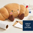 Plush bee toy on a white surface with gift wrap materials, labeled 'Great for Gifting'.