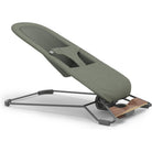 An ergonomic office chair with a muted olive green fabric seat, a dark gray metal frame, and a small wooden footrest, shown on a plain white background.
