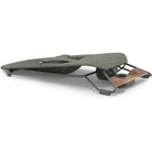An outdoor camping lounge chair with an olive green fabric seat, a dark gray metal frame, and a wooden footrest, shown on a plain white background.