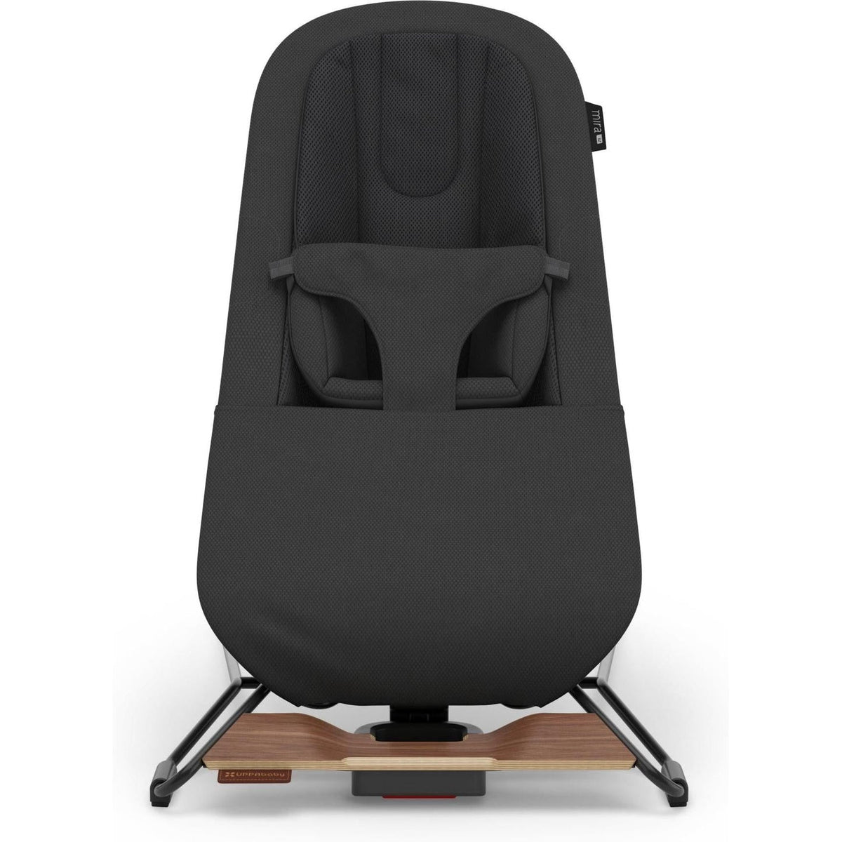 A black baby seat cover fitted over a stroller, shown from the front against a plain white background. The cover includes a padded headrest, harness straps, and a pocket on the front, while the stroller base with a light wood platform is visible underneath.