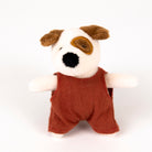 Stuffed toy dog with a red romper on a white background - from the front