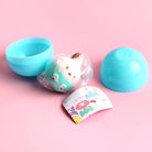 Blue toy egg with a white plush toy inside on a pink background