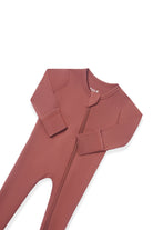 A dusty rose full-body zip-up sleeper or one-piece pajama laid flat on a white background.