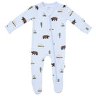 Baby onesie with bear and tree pattern on a light blue background