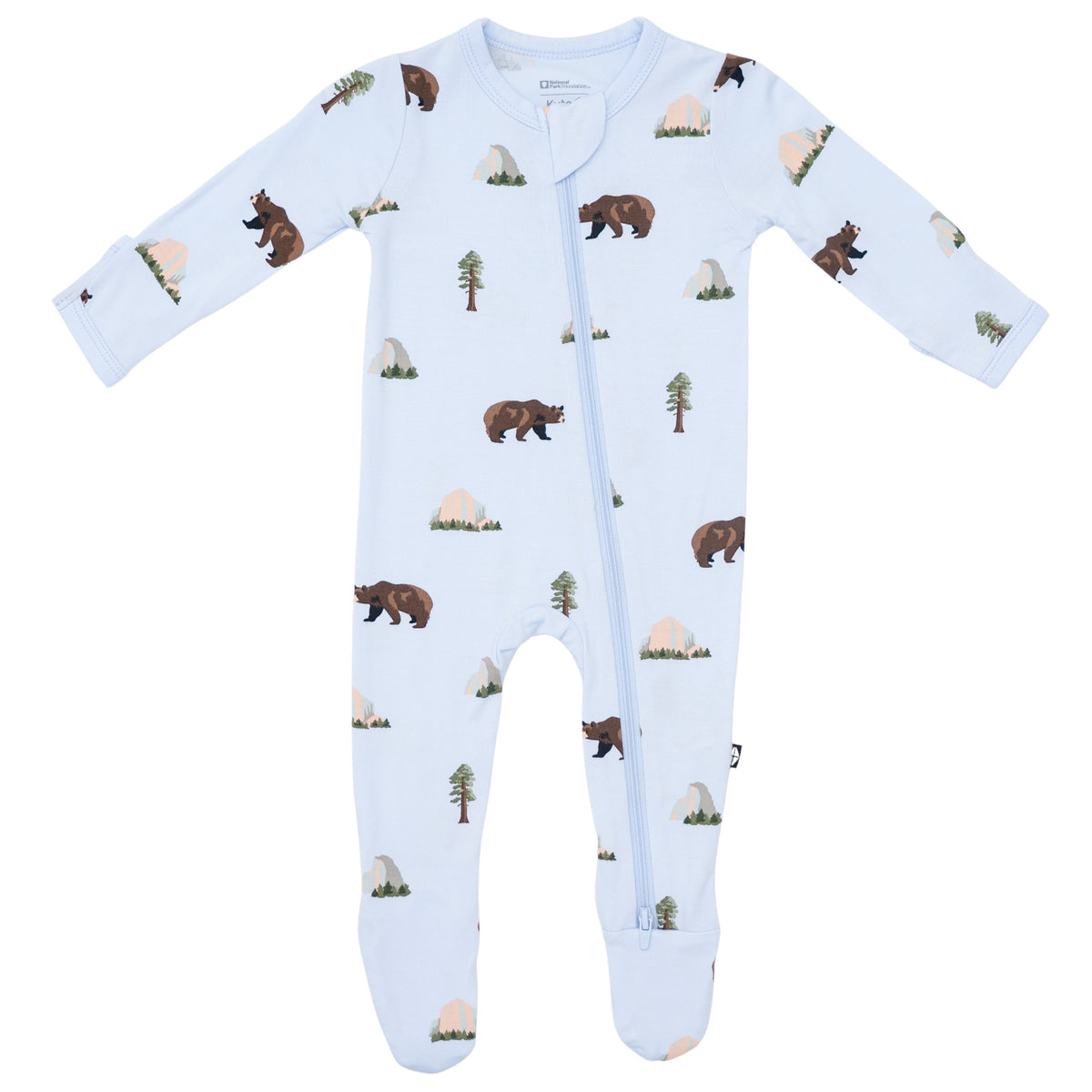 Baby onesie with bear and tree pattern on a light blue background