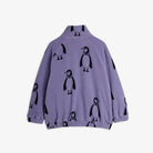 A lavender purple fleece jacket with an all-over black penguin print, featuring a mock neck and elastic cuffs and hem, shown against a plain light gray background.