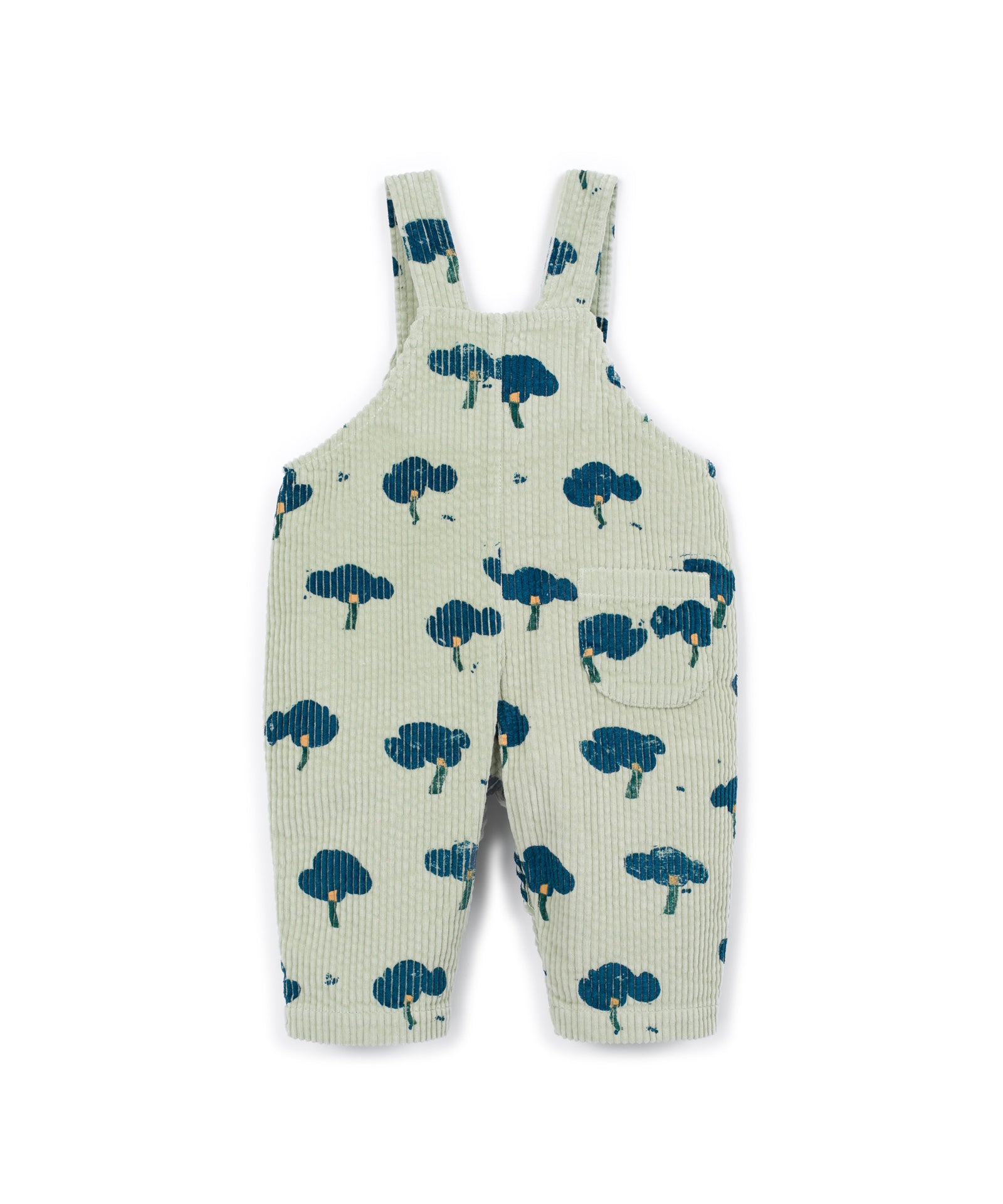 A pair of ribbed corduroy baby overalls in a light sage green color, featuring a dark blue tree print pattern, shown flat on a white background.