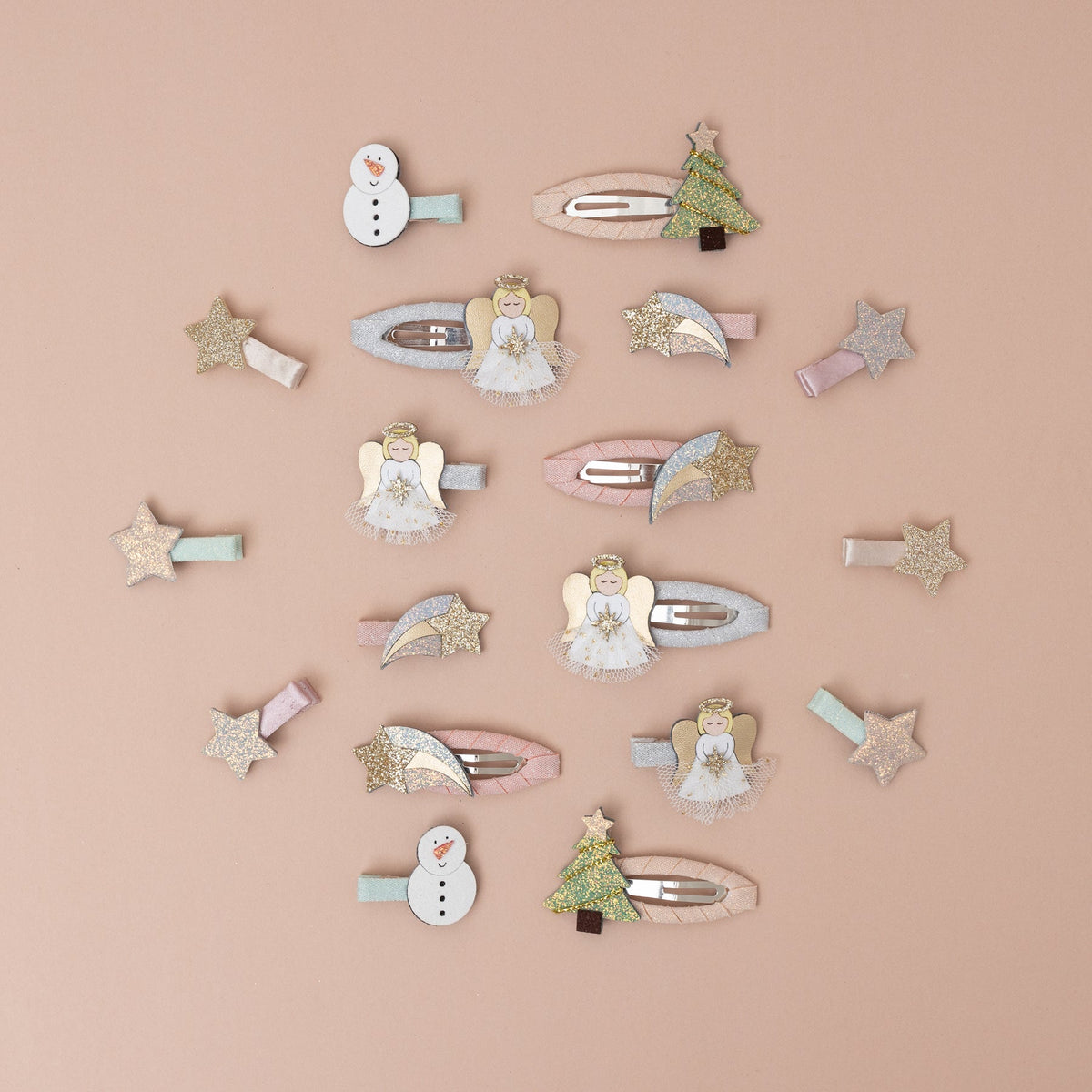 Collection of decorative hair clips on a beige background