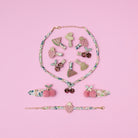 Collection of colorful hair clips on a pink background