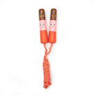 Children's jumping rope with cartoon faces on the handles against a white background
