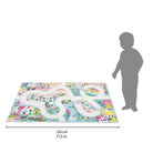 Children's play mat with road patterns and a child's silhouette for scale on a white background