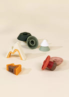 Set of colorful wooden toys on a beige background
