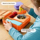 Child interacting with a colorful lunch box on a wooden surface, emphasizing safety features.