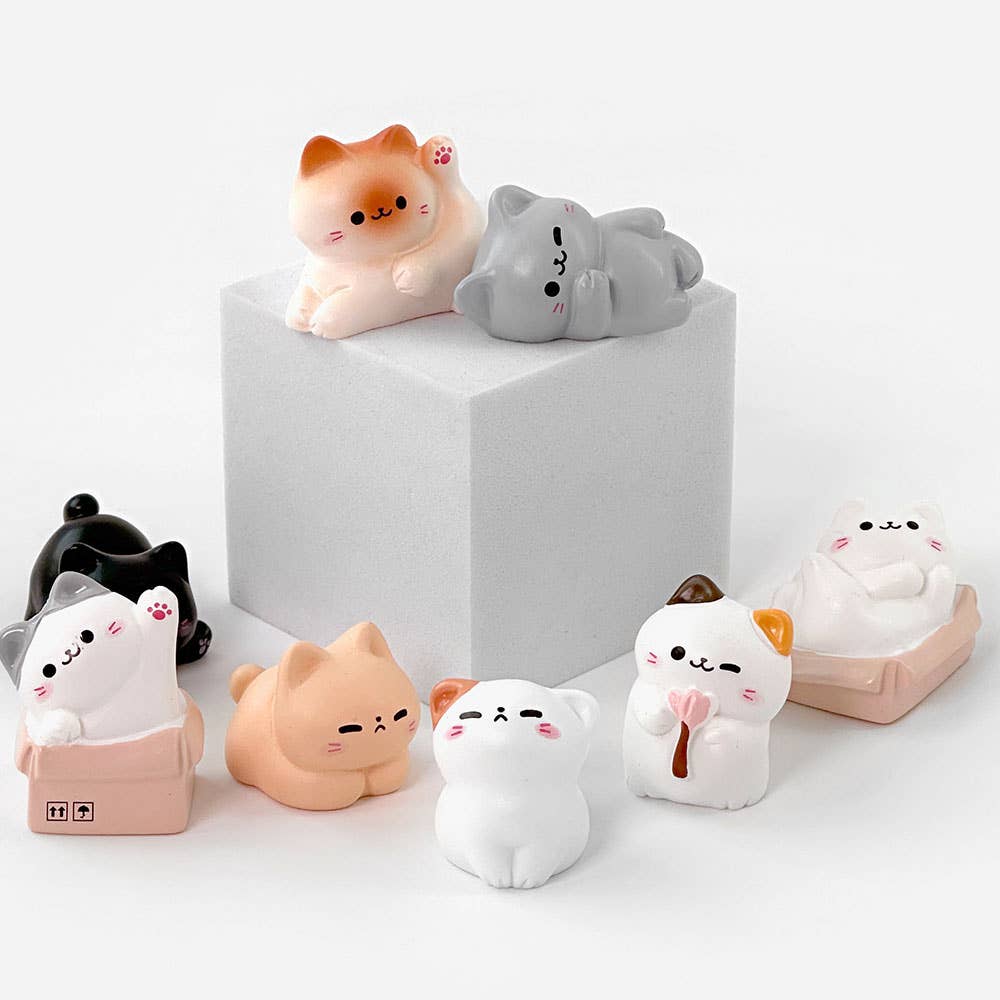 Set of cute cat-shaped squishies on a white background