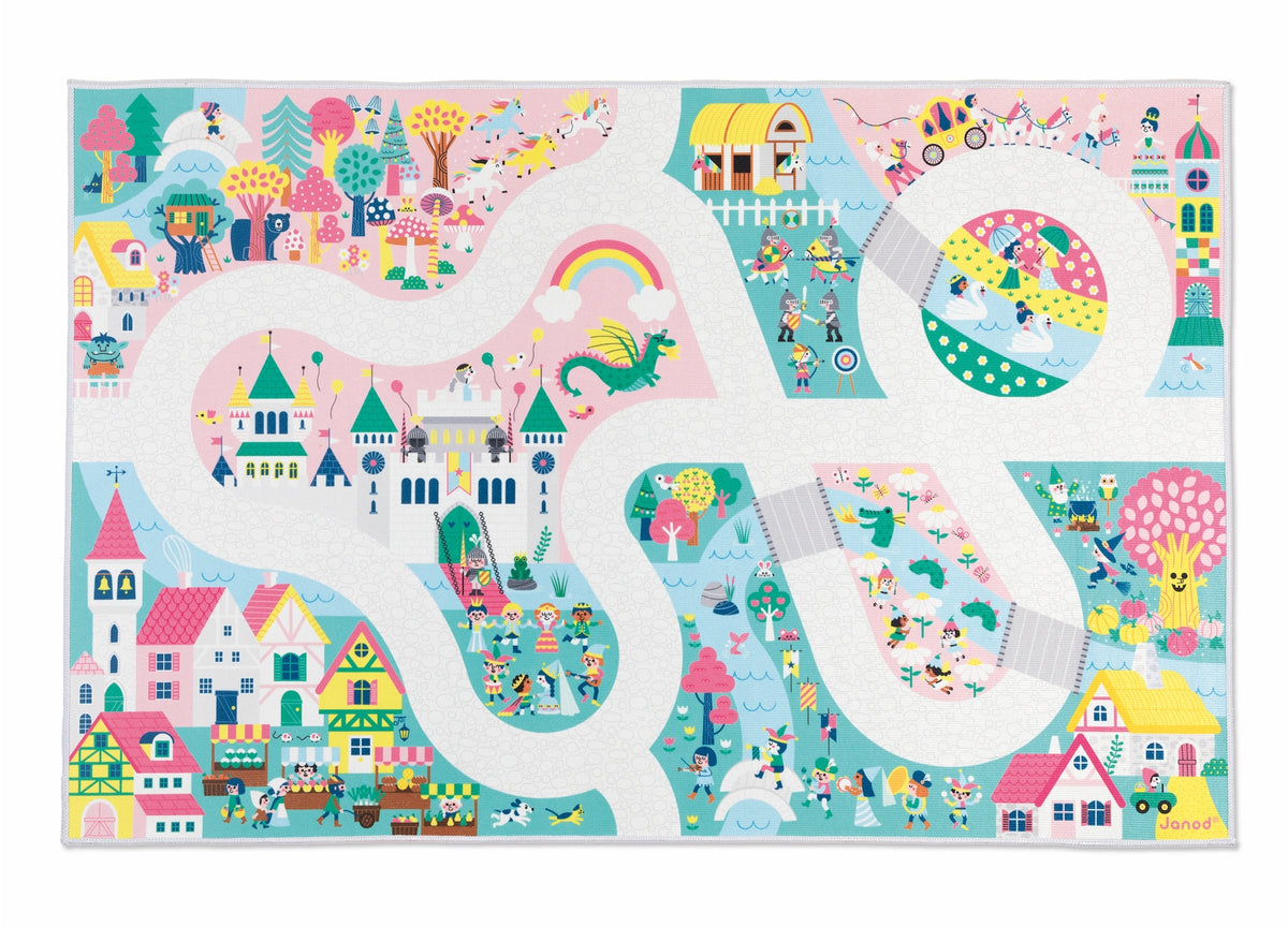A colorful children's play mat featuring a whimsical illustrated landscape with winding white roads, pastel houses, trees, animals, and playful scenes. The design uses soft pastel colors including pink, blue, yellow, green, and purple.