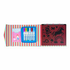 Children's art set with markers, paper, and stencils on a striped background