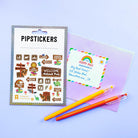 PipStickers packaging with a letter and two pens on a light blue background