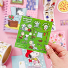 Scratch 'N Sniff laundry card with cartoon characters on a pink background