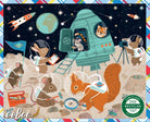 A colorful children's book cover or art print featuring an illustrated space-themed scene with animals dressed as astronauts on a moon surface. A teal rocket ship, planets, stars, and several cartoon animals are visible.