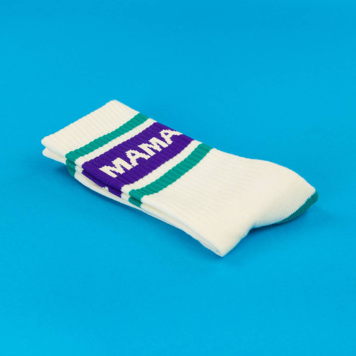 White sock with purple band labeled 'MAMA' on a blue background