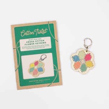 Cotton Twist cross stitch flower keyring kit with a completed keyring on a white background
