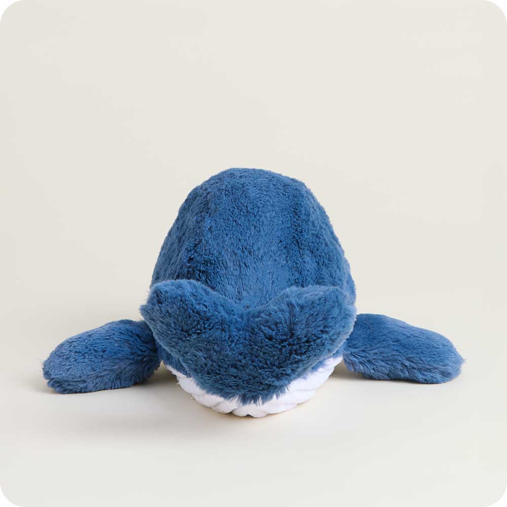 Blue plush toy on a light gray background